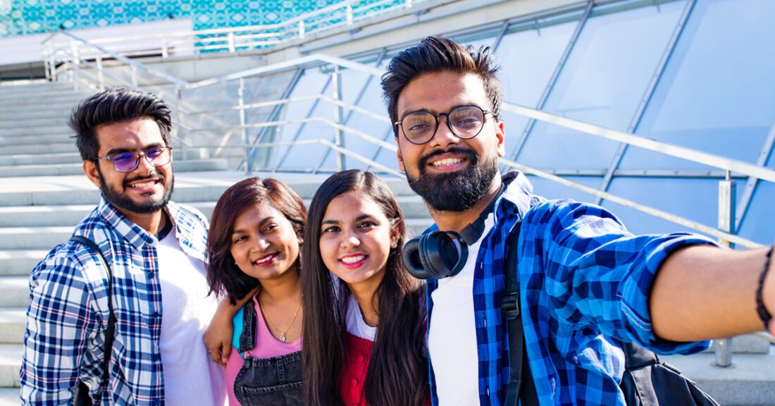 Teens of Asian Indian descent have fun hanging out together.